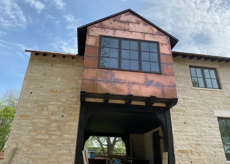 Copper metal panel facade on a stone building for Metal Roof Coating in Channelview