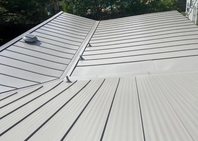 Solar attic fan installed on a metal roof for Roof Ventilation in Channelview
